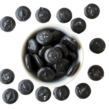 Traditional Finnish salmiakki salty licorice candies in various black diamond shapes