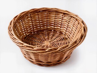 Fototapeta premium A classic, empty, round wicker basket crafted from natural wicker. A minimalist product shot against a clean white background, perfect for kitchen design, decor, and food storage.