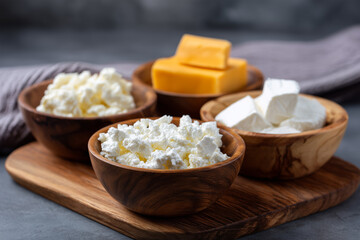 Delightful cheeses and creamy textures adorn a rustic wooden platter