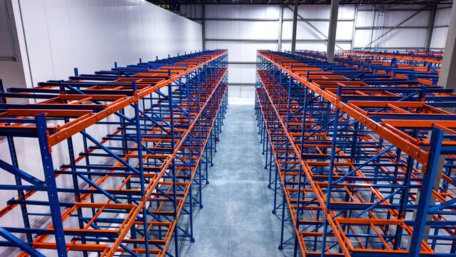 Interior of modern warehouse with empty racking system design for cold storage