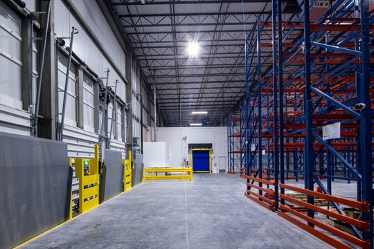 cold storage industrial freezer warehouse loading docks, roll up doors, high speed doors, and steel racking system for storage