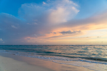 Obraz premium Calm Waters Off the Coast in Punta Cana Dominican Republic With a Colorful Sky at Sunrise