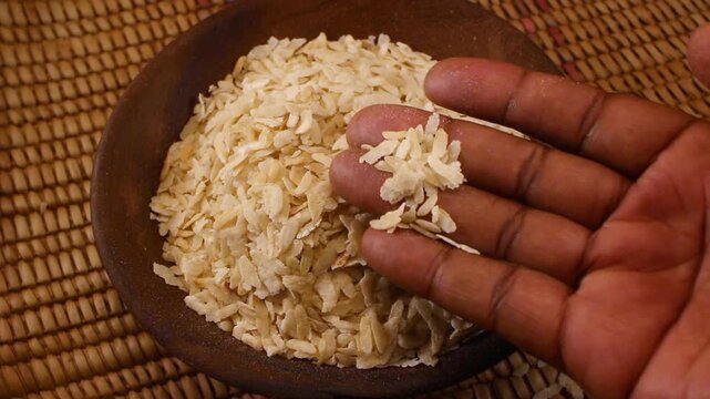 Traditional Toasted and Pounded Green Rice, known as Cốm in Vietnam, Ambok in Cambodia, Pinipig in the Philippines, Matago in Zambezia Province, Mozambique
