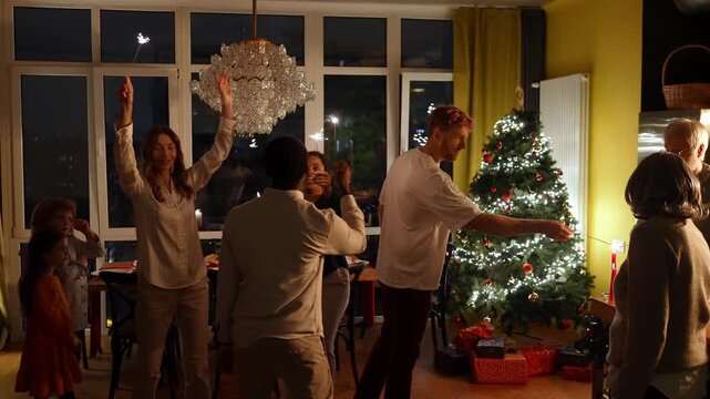 Family and guests dancing and holding sparklers