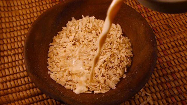 Milk Poured Over Pounded and Flattened Green Rice Cereal, known as Cốm in Vietnam, Ambok in Cambodia, Pinipig in the Philippines, and Matago in Zambezia, Mozambique