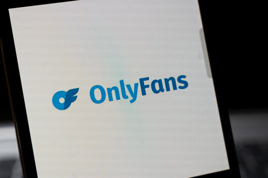 Warsaw, Poland - Feb 24, 2026: Close-up of the OnlyFans logo displayed on a smartphone screen, representing the online subscription platform known for adult content sharing.