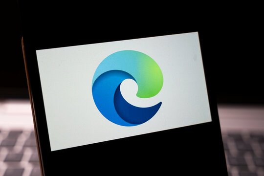 Warsaw, Poland - Feb 24, 2026: Close-up of the Microsoft Edge logo displayed on a smartphone screen, symbolizing modern technology and digital browsing.