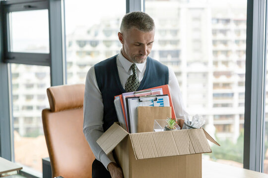 Unemployment crisis of man dismissed. Business man packing stuff. Resign and resignation. Change of job or fired from company resign. Losing his job. Jobless man unemployed. Career failure