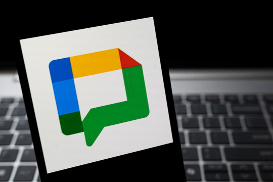 Warsaw, Poland - Feb 24, 2026: Close-up of Google Chat logo displayed on a white sheet, symbolizing digital communication and collaboration tools in modern technology.