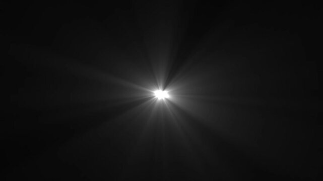 Bright starburst light flare with rays of light
