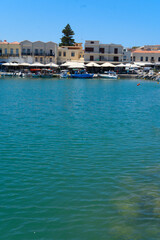 Fototapeta premium harbor and lighthouse of Rethymno old town, Crete, Greece, retro toned