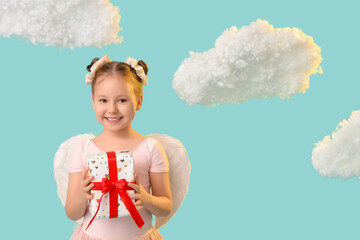 Naklejka premium Cute little girl dressed as cupid with gift box and clouds on blue background. Valentine's Day celebration