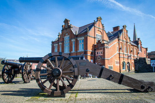 Derry / Londonderry, UK, March, 2017. View of a restored cannon placed on the Derry City Wall on a sunny day.