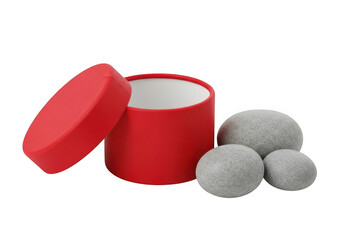 A red cylindrical container with a lid and three gray balls next to it. isolated on transparent background