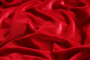 Obraz premium Texture of red velvet fabric as background