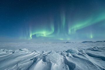 Northern Lights Over Arctic Snowfield At Night With Starry Sky And Icy Foreground.