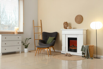 Fototapeta premium Interior of living room with fireplace, armchair and slippers
