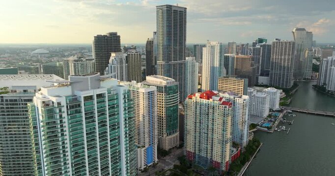 Miami Brickell in Florida, USA at sunset. View from above of waterfront skyscraper buildings in downtown district. American megapolis with business financial district.