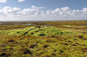 2 northernmost prehistoric cairns on peat moorland 400 m E of Loch a Phobuill Stone Circle. North Uist, Outer Hebrides. View WNW to Clachan a Luib