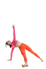 Naklejka premium Sporty young woman doing yoga on white background