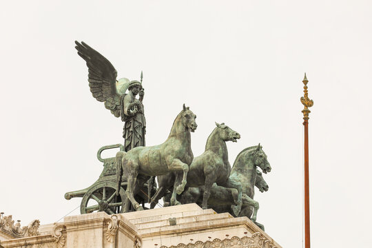 Winged Victory driving a quadrigae (four-horse chariot) on top of the Victorio Emmanuel II Monument in Rome, Italy. Symbol of freedom and unity.