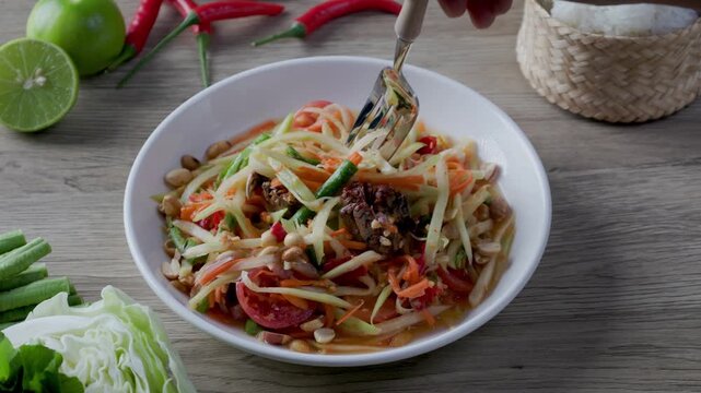 Somtum - Thai spicy papaya salad with herring