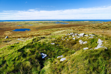 Clettraval Wheelhouse prehistoric Iron Age aisled roundhouse site on S slope of South Clettraval, N. Uist. WSW over interior to coast © David Matthew Lyons
