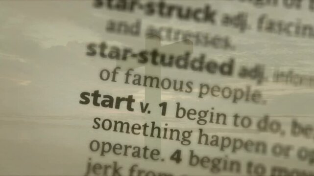 Lens pulling focus from blur, sharpening dictionary and emphasizing headword start with signpost