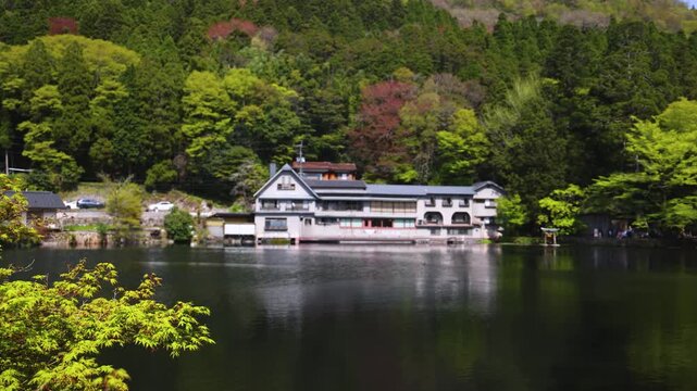 Kinrin lake in Yufuin town, Kinrin-ko lake, Oita prefecture, Japan, hot spring onsen resort town, with mount Yufu, Kyushu island region, rural mountain landscape, a spring day with a blue sky