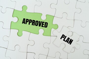 APPROVED PLAN word alphabet letters on puzzle