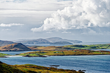 South from the slopes of Heaval on Barra across Castle Bay to crofts on east coast of Vatersay with the islands of Sandray, Lingeigh, Pabbay and Mingulay behind © David Matthew Lyons