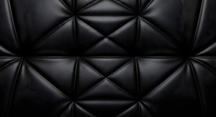 Fototapeta premium Black leather upholstery texture with padded geometric pattern and glossy highlights creating a sophisticated luxury background suitable for premium branding and interior design visuals