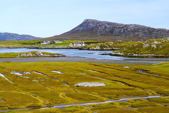 View N.E. over north region of Grimsay, just east of North Ford Causeway, to Eaval mountain on North Uist. Outer Hebrides, Scotland