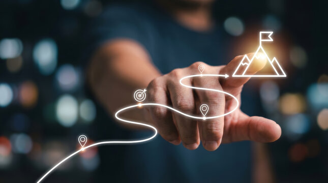 Close up business person hand touching achievement goal mountain peak icon with confident emotion over blurred night city background showing digital strategy plan path to success and vision