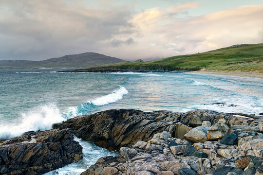 Nisabost Beach, Harris, Outer Hebrides. Neolithic standing stone MacLeods Stone on horizon centre right marks Neolithic through to Norse enclosures