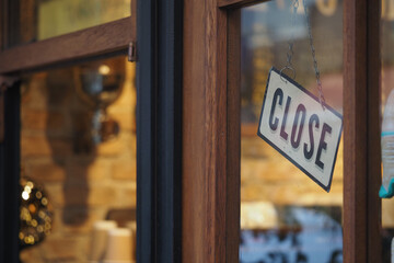 Store is closed with sign on the door