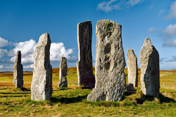 Fototapeta premium Tursachan prehistoric Neolithic stones at Callanish, Isle of Lewis, Scotland. aka Callanish I. The tall central monolith and part of the core circle