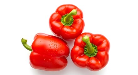 Three fresh red bell peppers on white background