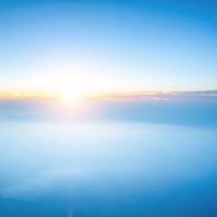 Fototapeta premium a view of the sun setting over clouds, casting warm golden light across soft, billowing cloud tops in a tranquil sky