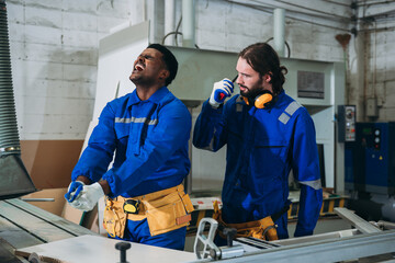 Professional Carpenter Injured While Working on Timber Project in Industrial Woodworking Workshop, Workplace Accident During Construction and Manufacturing Process.