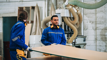 Professional Woodworker Measuring, Cutting and Installing Timber in Factory. Carpentry and Wood Manufacturing Process in Industrial Workshop