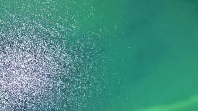 Aerial view drone shot flying over tropical sea in good weather day beautiful sea and beautiful water surface	