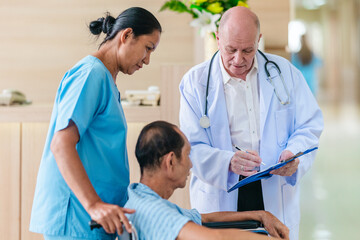 Obraz premium Medical Team Assisting Male Patient in Wheelchair