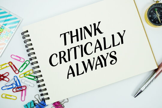 Think Critically Always text message written on notepad with stationery flat lay on white background