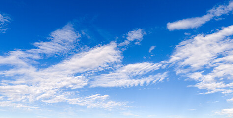 Fototapeta premium Sky blue clouds texture. Bright sky soft backdrop. Daytime sky wallpaper pattern. Sky cloudscape cirrus.
