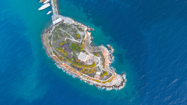 Kusadasi, Turkey. Historic Pigeon Island Fortress at sunset. Top down shot of the Genoese central tower, thick defensive walls, and the park. Aerial View