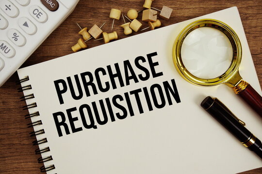 Purchase Requisition text written on notepad with calculator and magnifying glass flat lay on wooden background