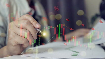 Stock market volatility concept with red percentage symbols and candlestick chart overlay. Investor hand analyzing financial report, trading strategy, risk management, market downturn, 