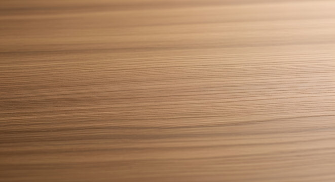 Close-up of horizontal wood grain texture on a light brown wooden surface.