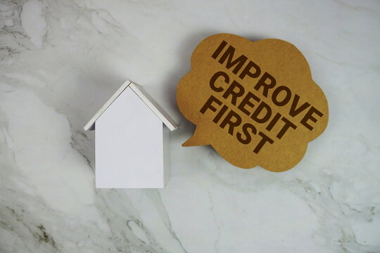 Improve Credit First text written on speed bubble and house model